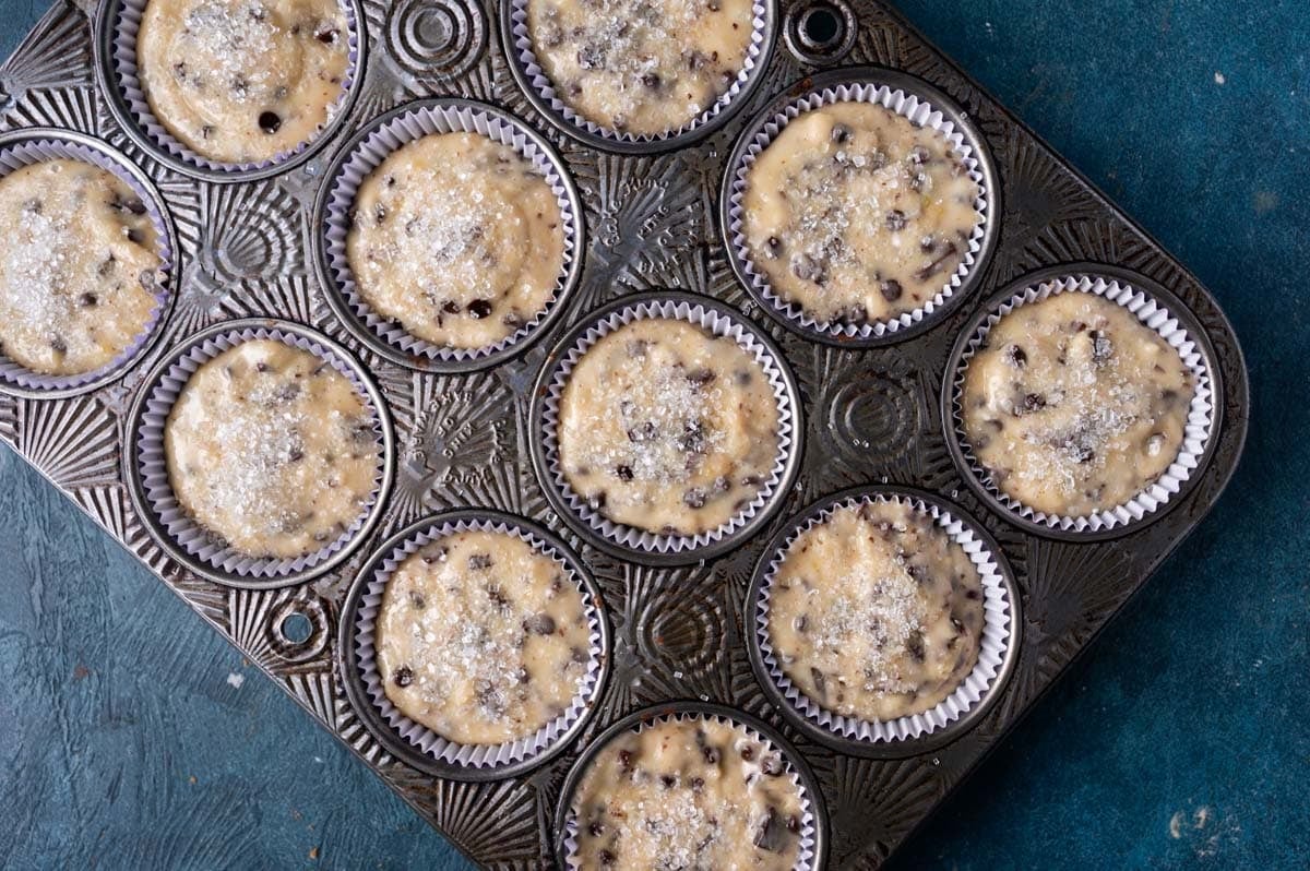 unbaked muffins in a baking tin