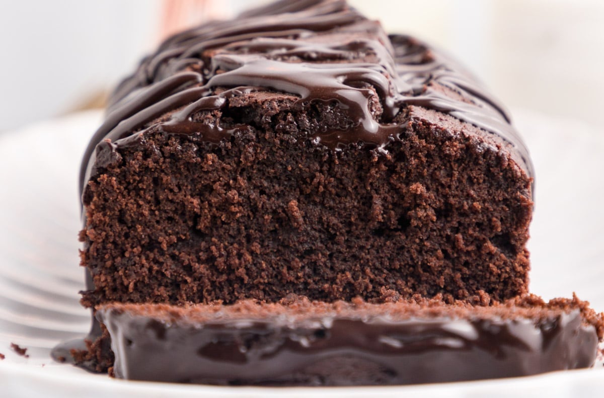 a chocolate olive oil loaf cake with a slice cut