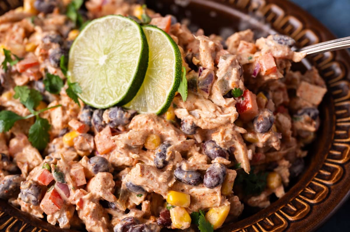 closeup of chicken salad in a bowl with beans and corn