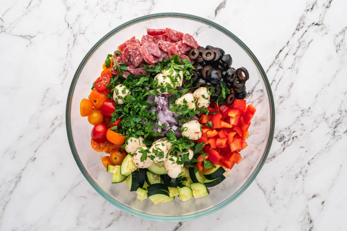 diced veggies, meat and cheese in a bowl