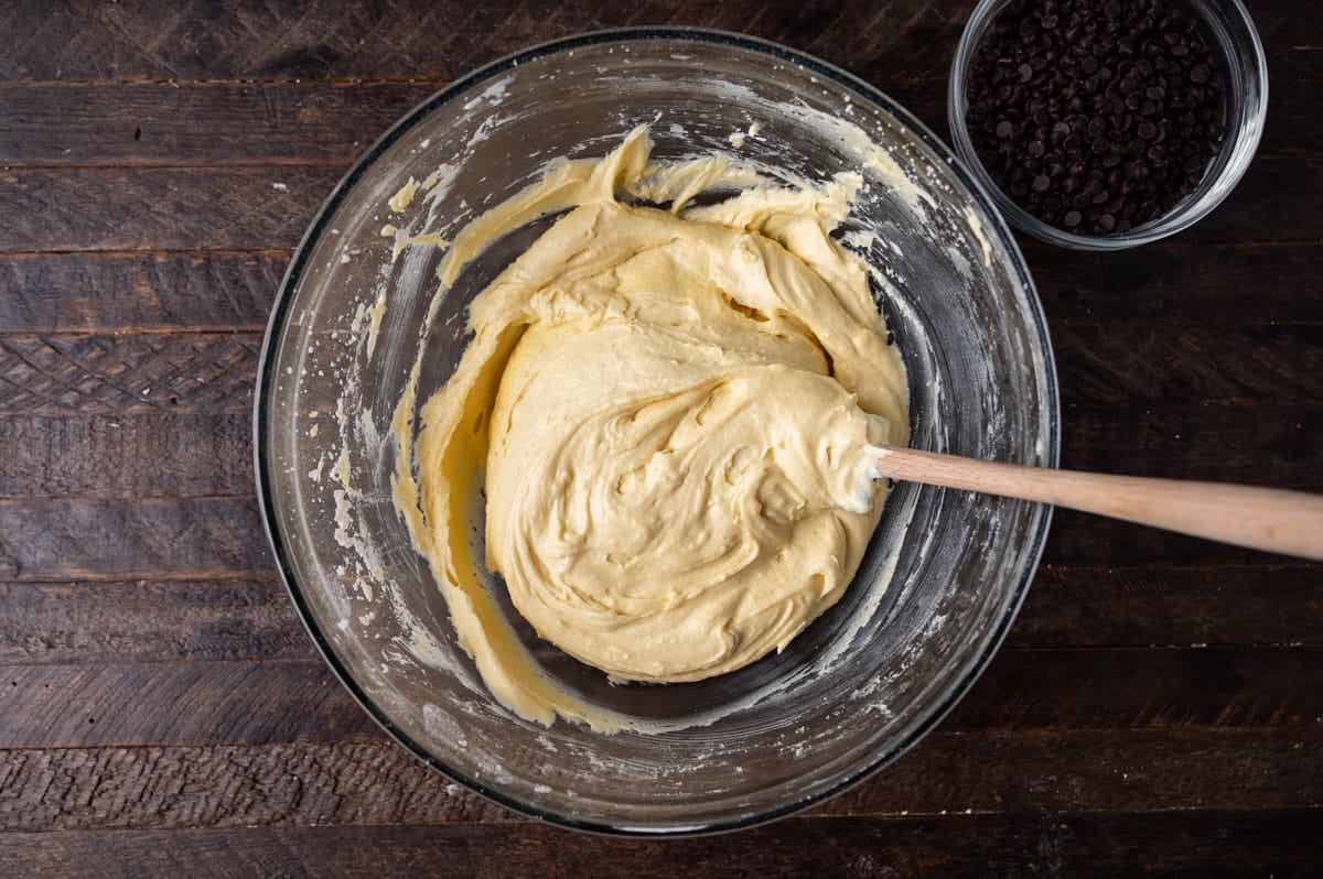 cake batter in a glass bowl with a spatula