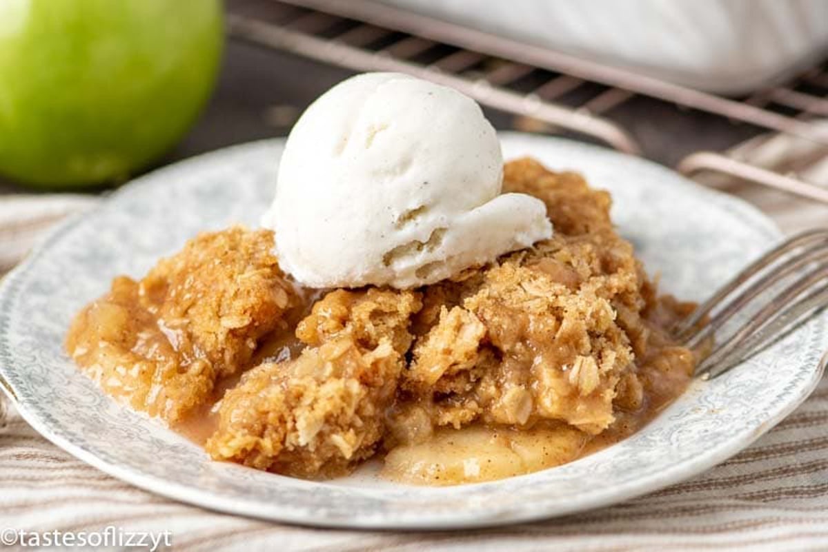 apple crisp on a table with ice cream