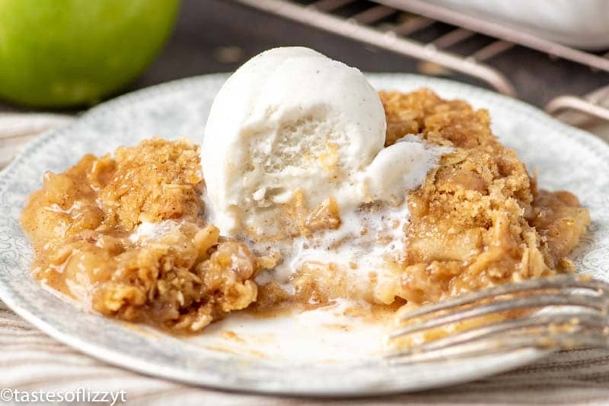 apple crisp on a table with ice cream