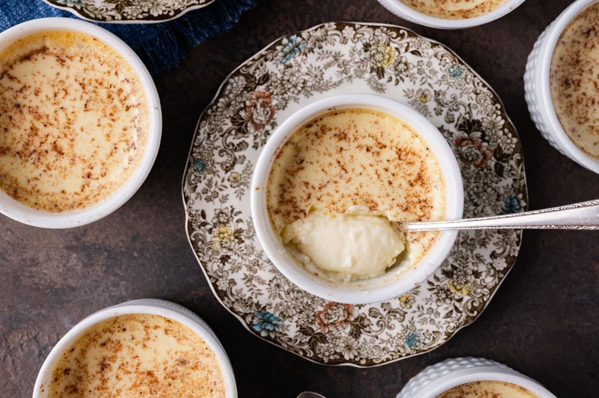 baked custard with creamy texture in a cup with a spoon