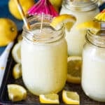 frozen lemonade in a mason jar with umbrella and straw