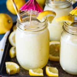 frozen lemonade in a mason jar with umbrella and straw