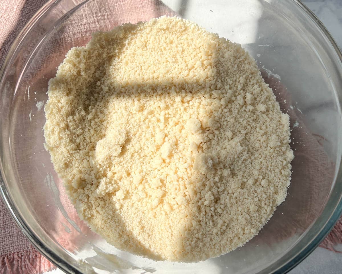 butter cut into flour and sugar in a bowl