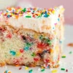 a piece of funfetti birthday cake on a plate