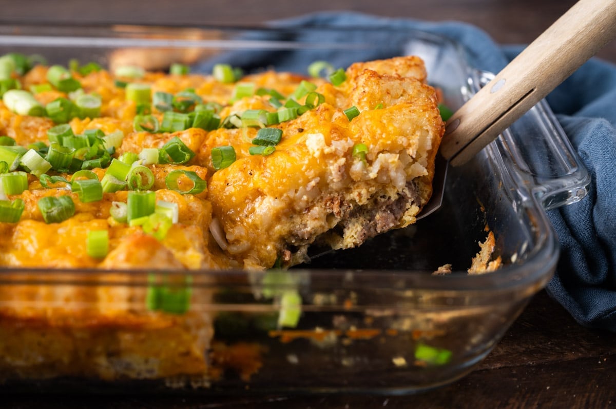 tater tot breakfast casserole in a pan with a spatula