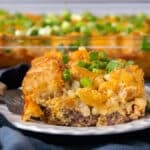 a slice of breakfast tater tot casserole on a plate