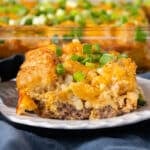 a slice of breakfast tater tot casserole on a plate