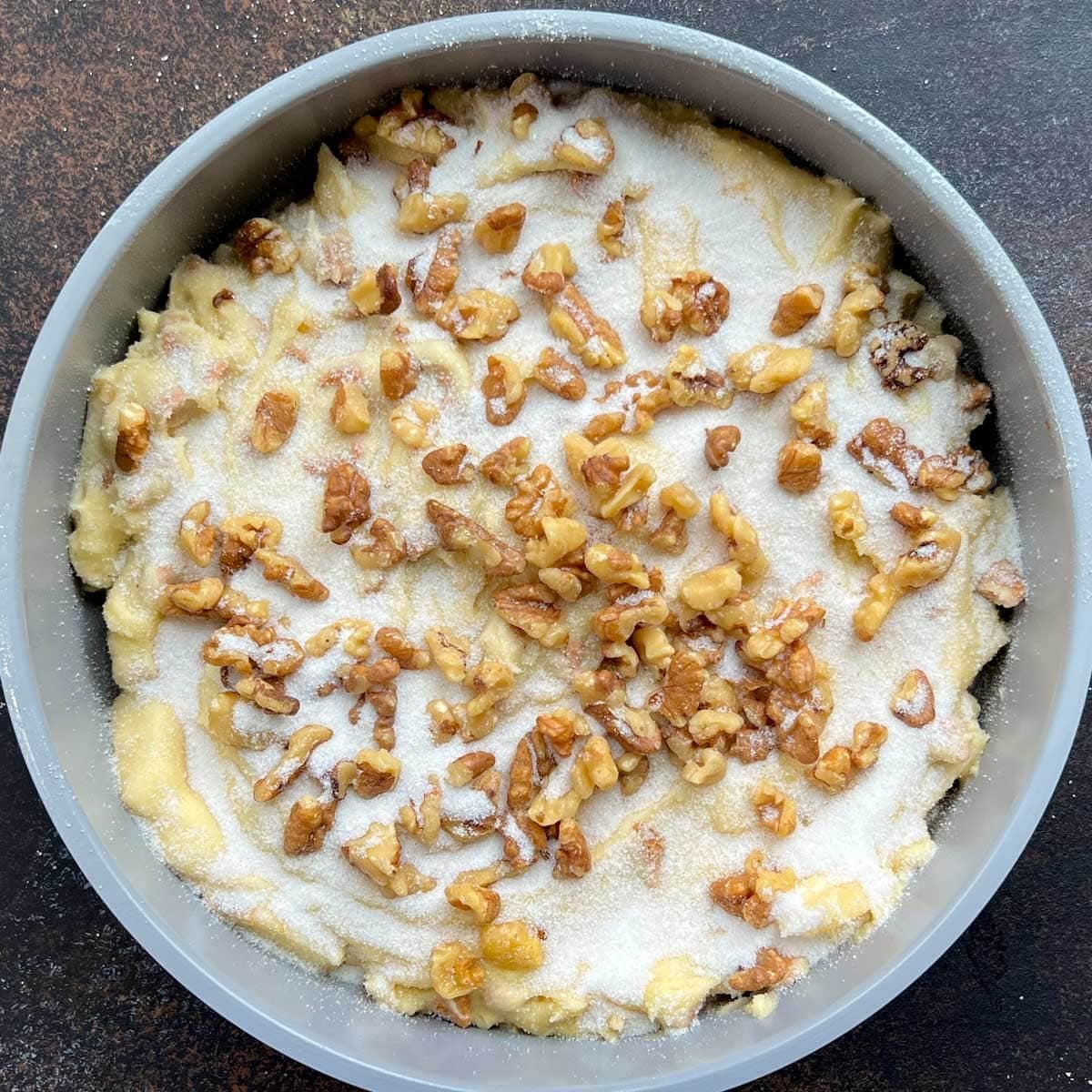 unbaked apple butterscotch cake on a table