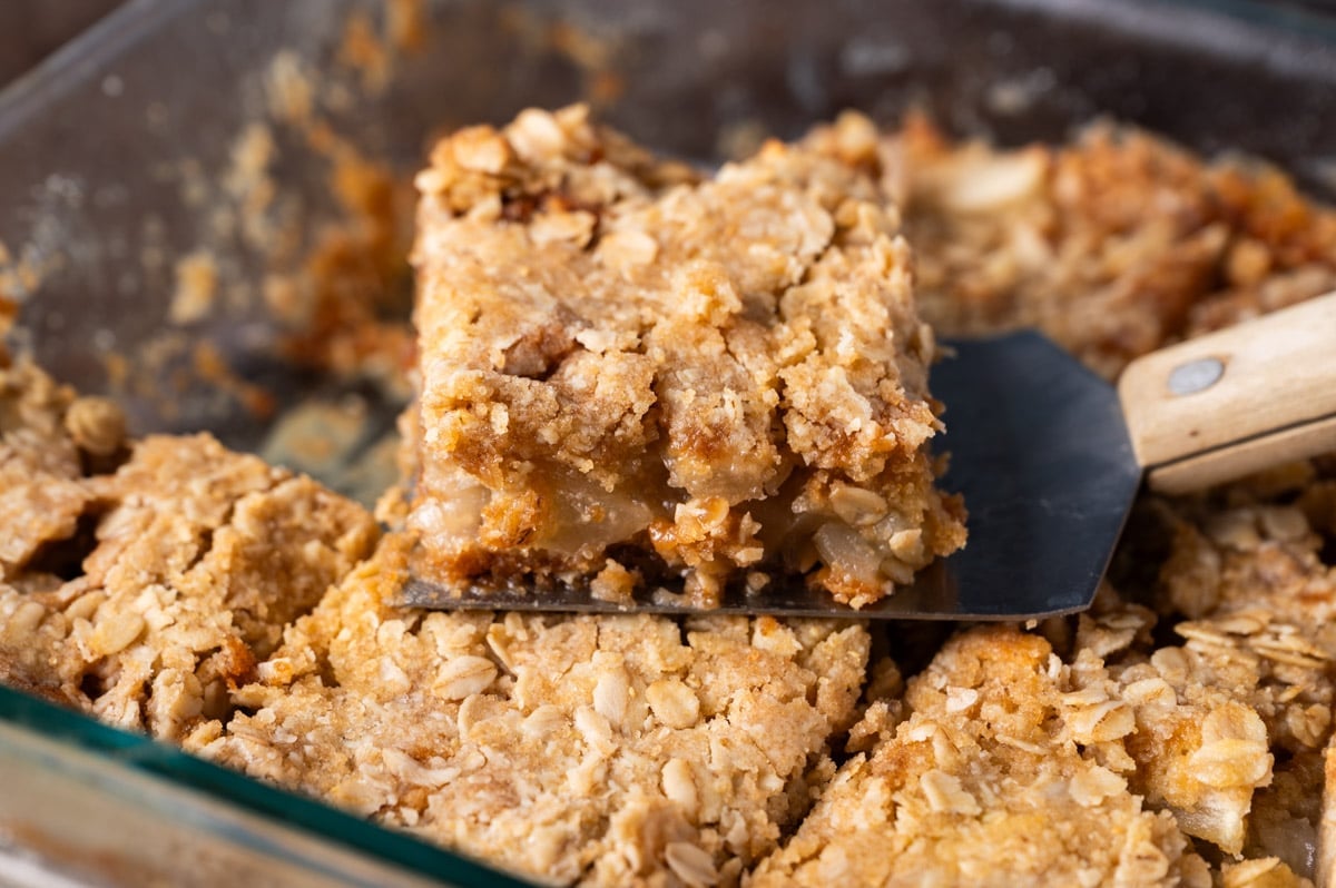 an apple bar with oatmeal topping on a spatula