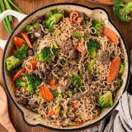 overhead view of beef and ramen noodles stir fry in a skillet