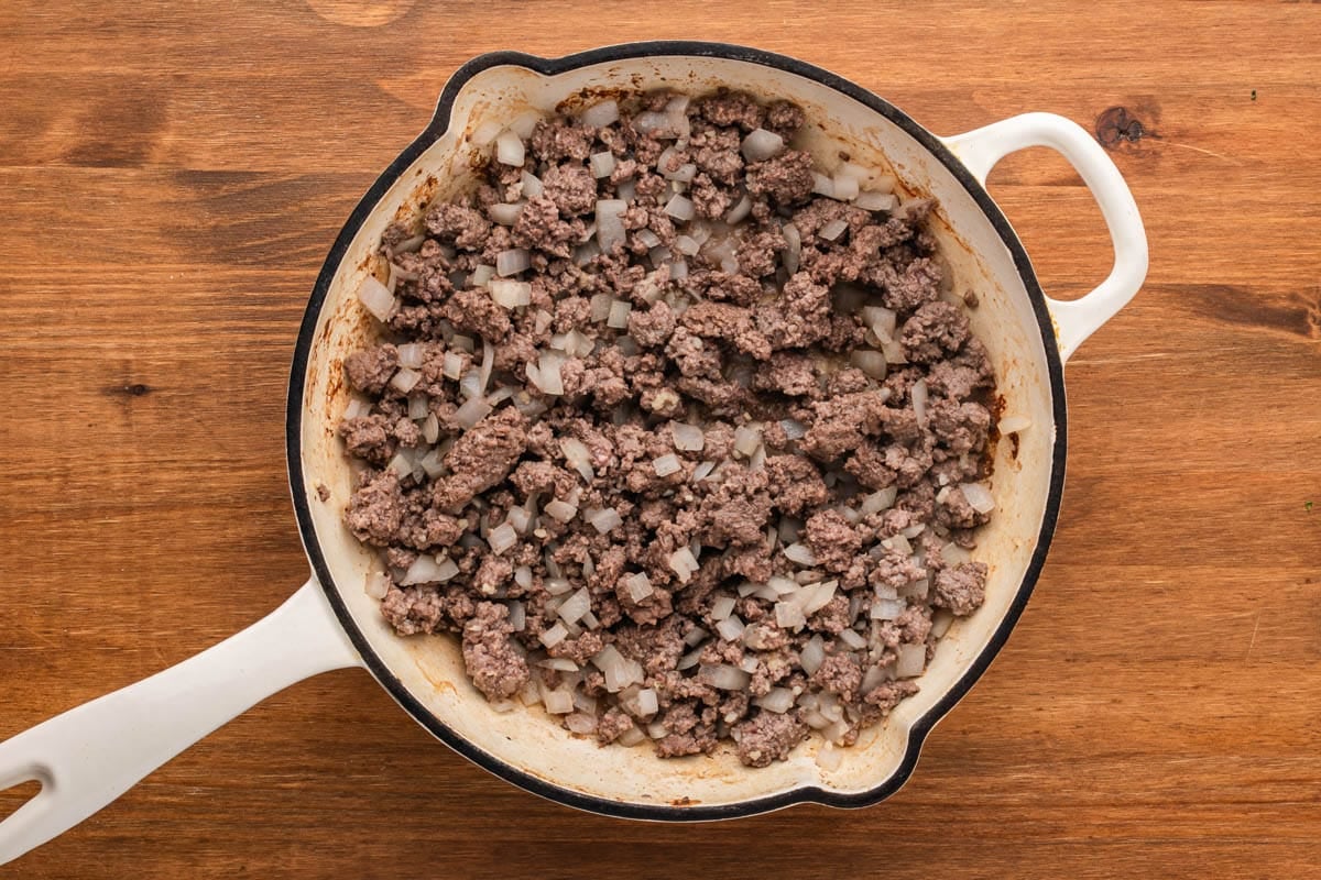 ground beef and onions in a skillet