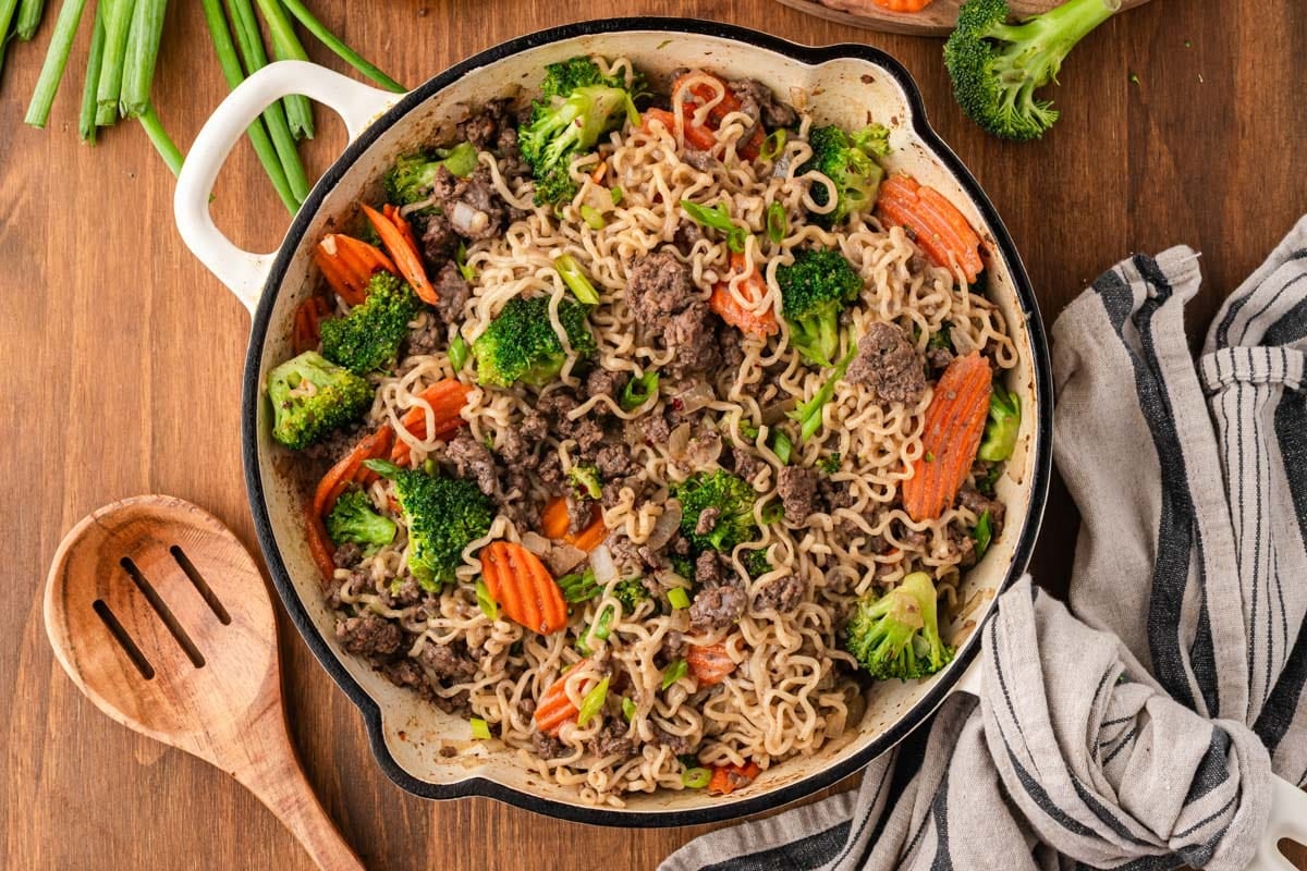 overhead view of beef and ramen noodles stir fry in a skillet