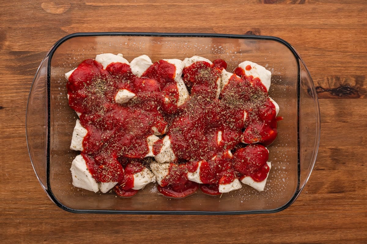 biscuits with sauce and seasoning over the top