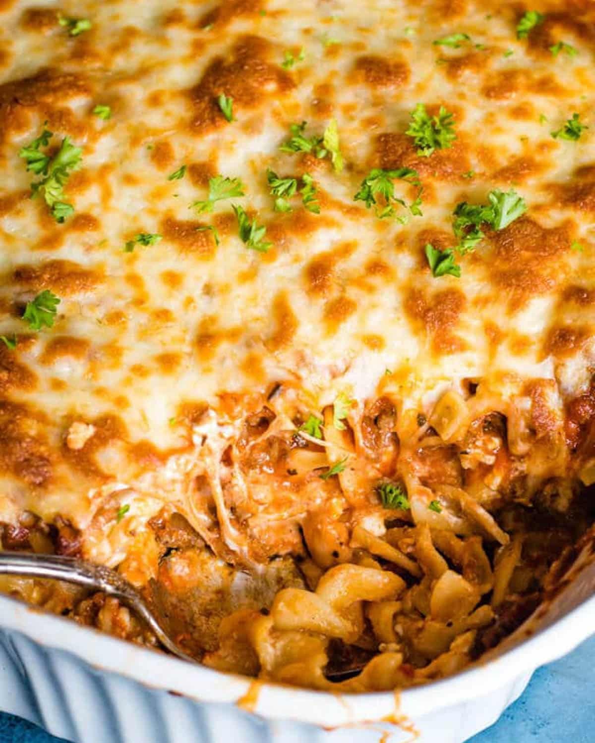 lasagna noodle casserole with a spoonful taken out