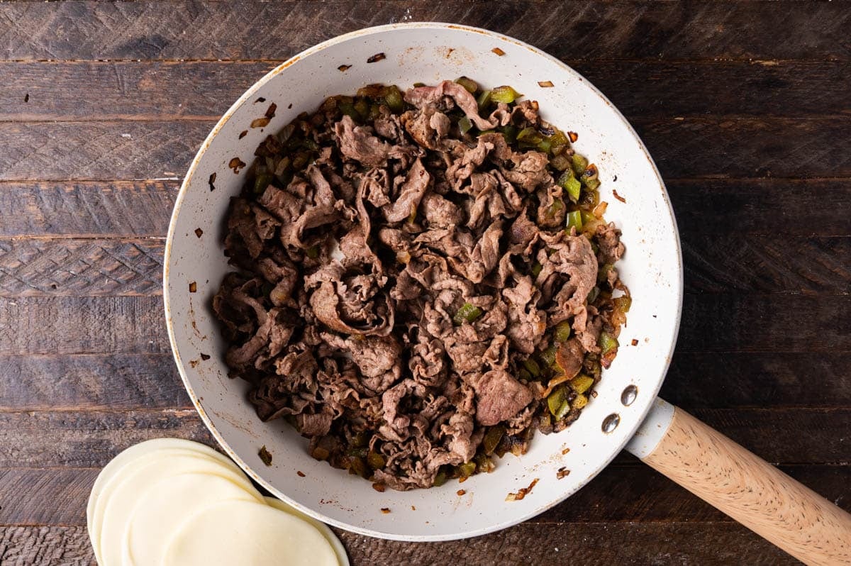 beef sautéed with onions and green peppers in a casserole