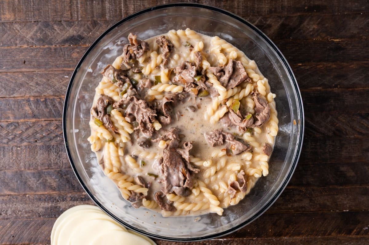 pasta and beef with creamy sauce in a bowl