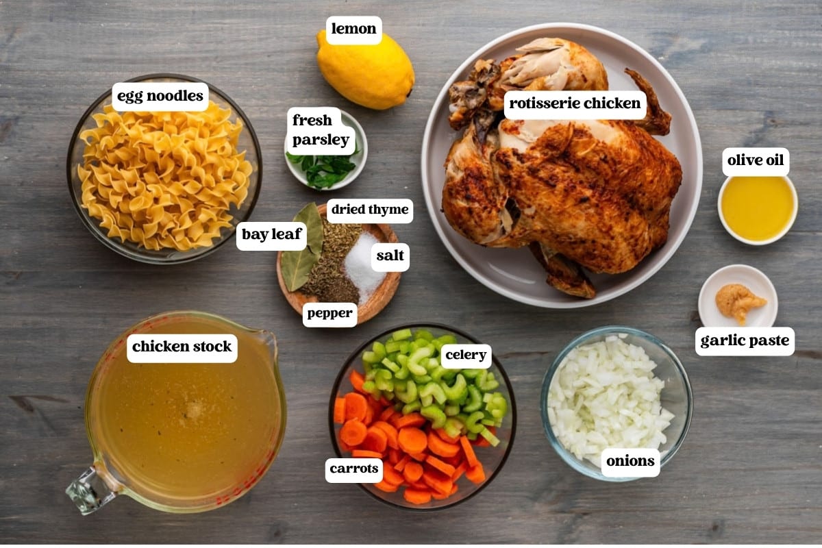 rotisserie chicken noodle soup ingredients on a table