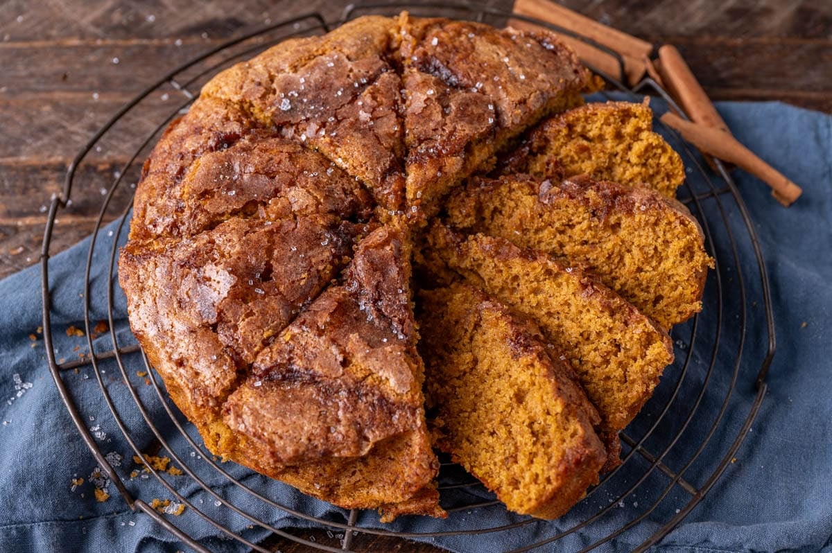 sliced sugar crunch pumpkin cake on a wire rack
