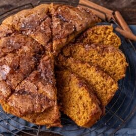 sliced sugar crunch pumpkin cake on a wire rack