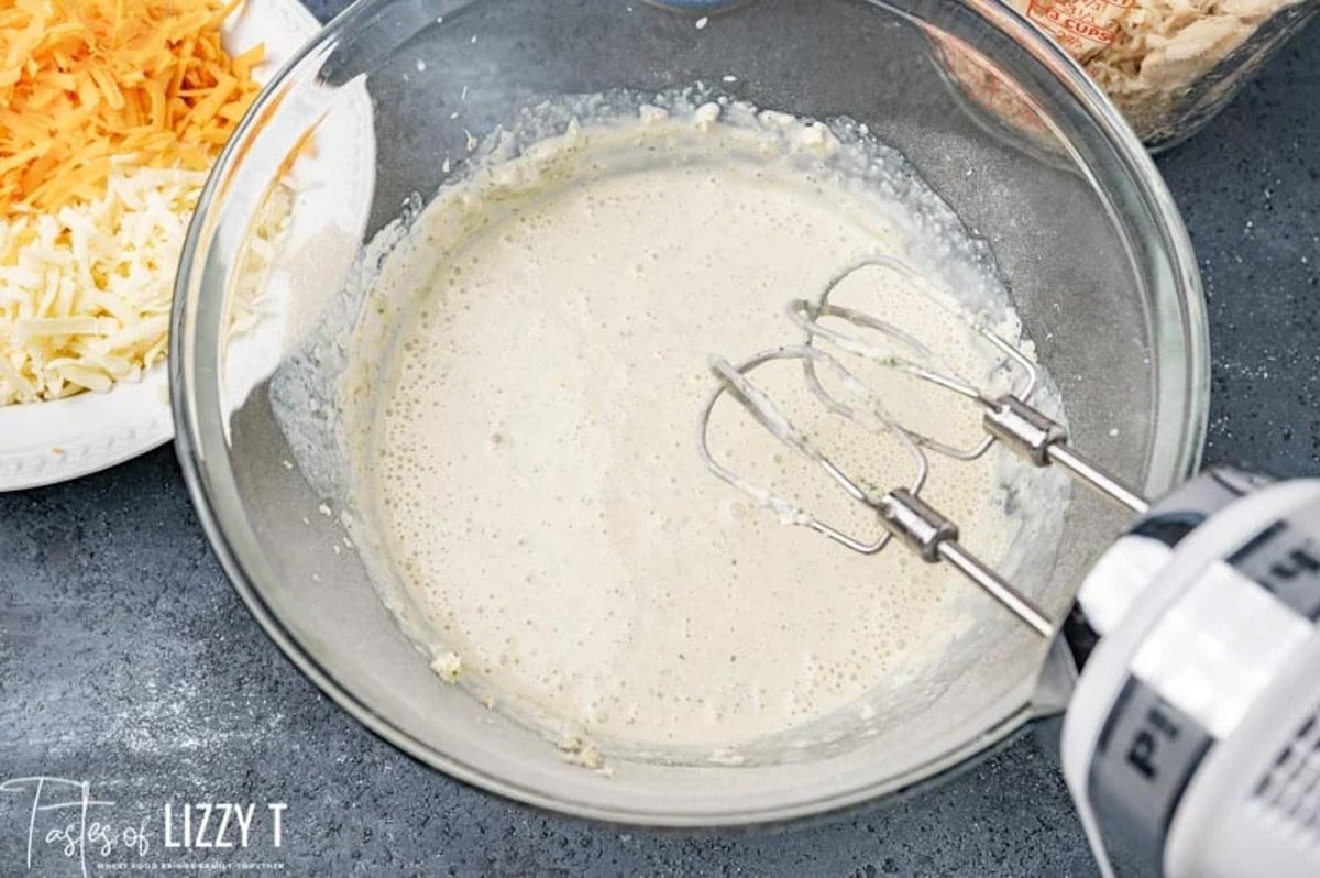 creamy ranch sauce in a bowl with a mixer
