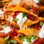 a taco stuffed shell on a spatula