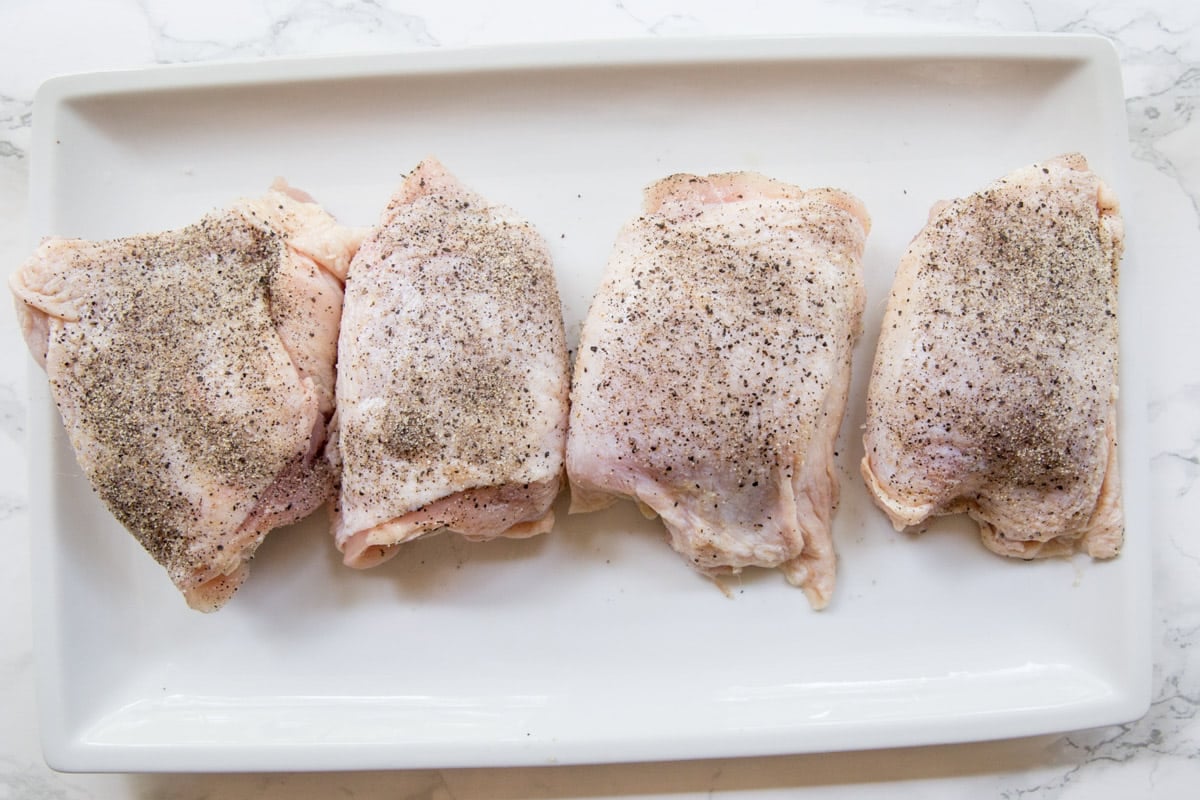 seasoned chicken thighs on a plate